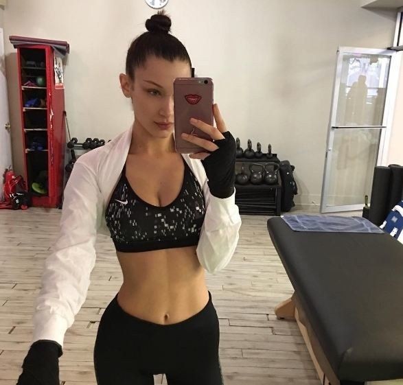 Bella Hadid taking a selfie of her incredibly fit abs