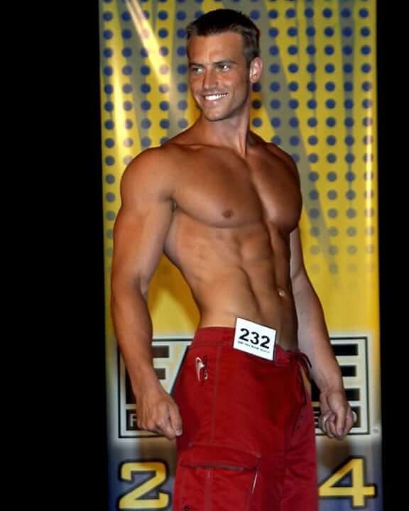 Nick Auger posing with his ripped physique during a fitness competition.